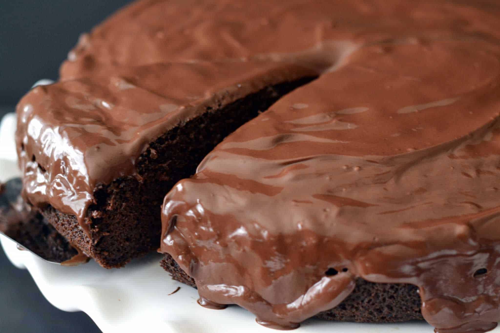 Black & White Cake from The Paleo Kitchen Cutting a slice of Black and White Cake