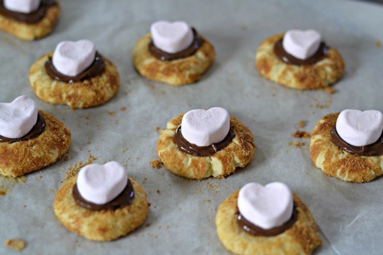Use cute pink heart-shaped marshmallows for a sweet Valentine's Day treat. Pink Heart marshmallows on cookies