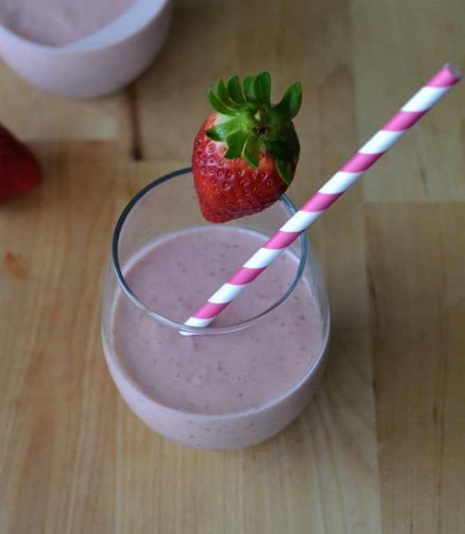 Strawberry Power Smoothie Strawberry Power Smoothie in a glass garnished with a strawberry