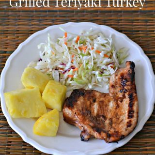 plate with grilled turkey, coleslaw, and pineapple