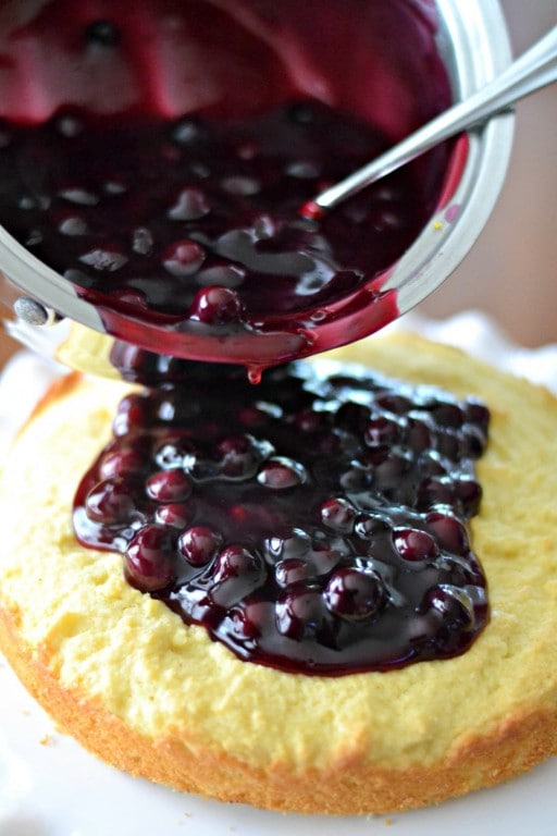 pouring sauce on Cake
