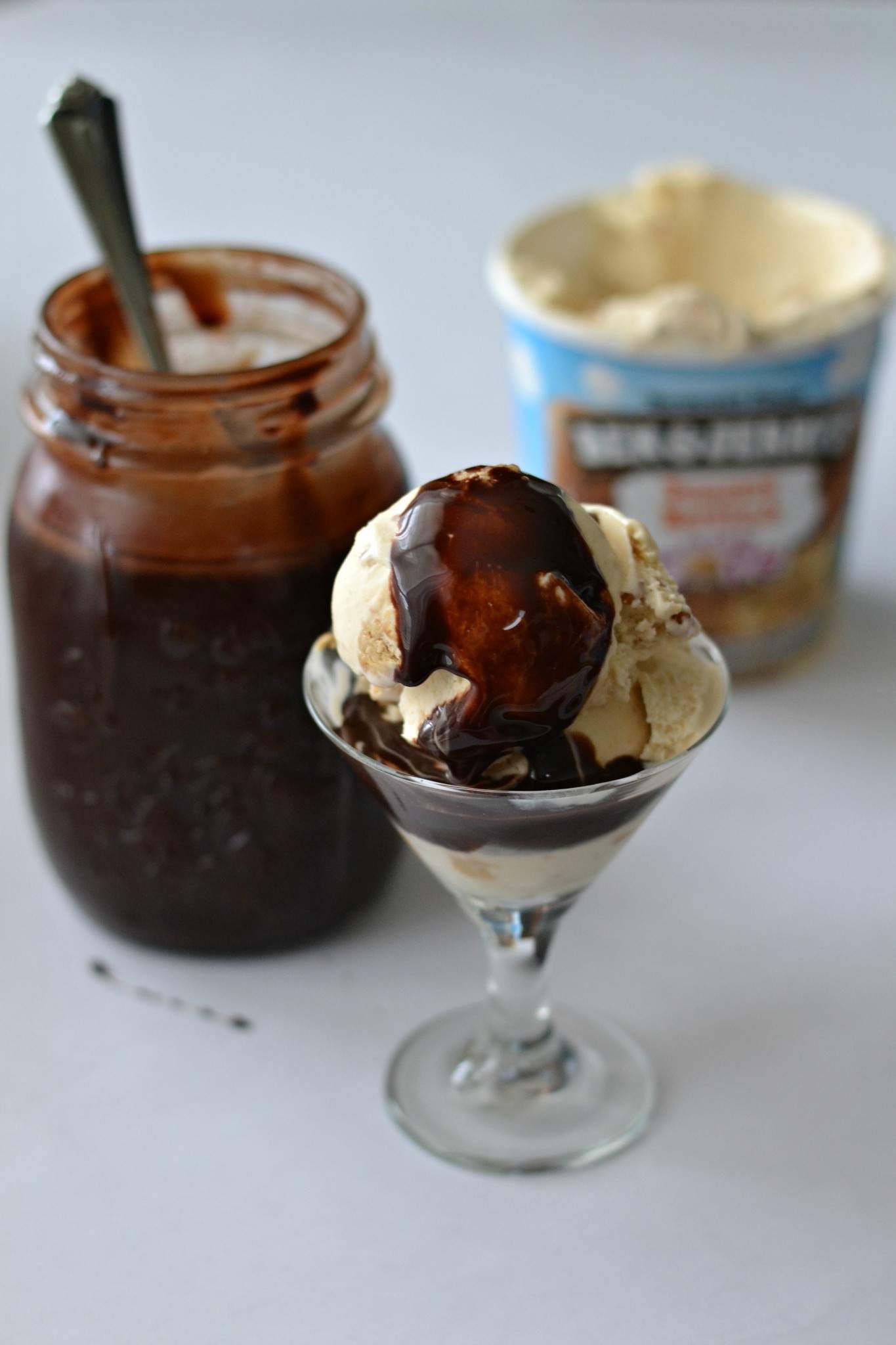 Chocolate syrup on ice cream.
