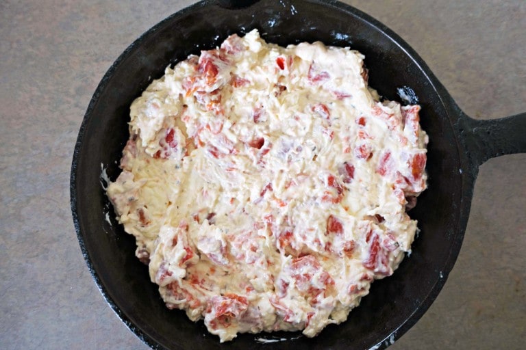 unbaked dip in a cast iron skillet