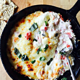 hot caprese dip in a skillet