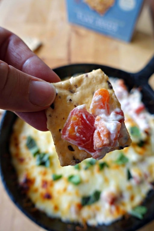 Hot Caprese Dip on a gluten-free cracker