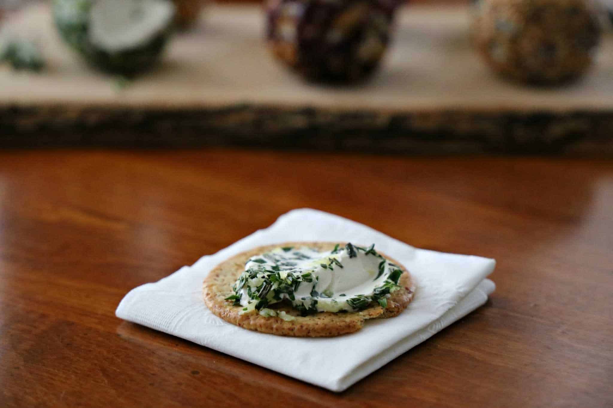Savory mini cheeseball on cracker