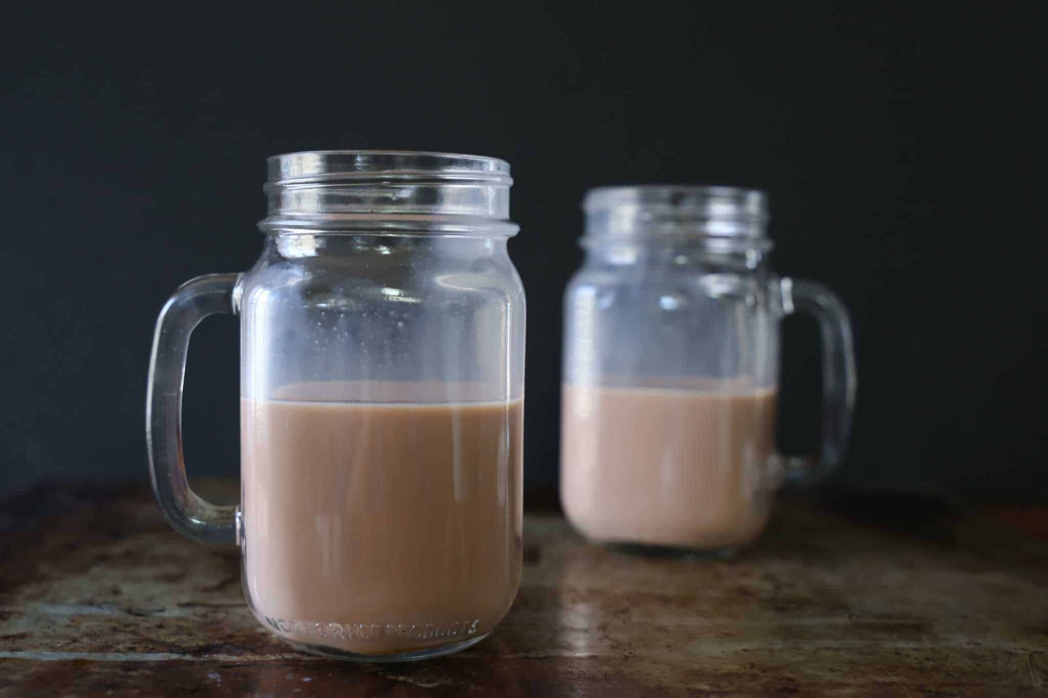 two mugs with chocolate milk