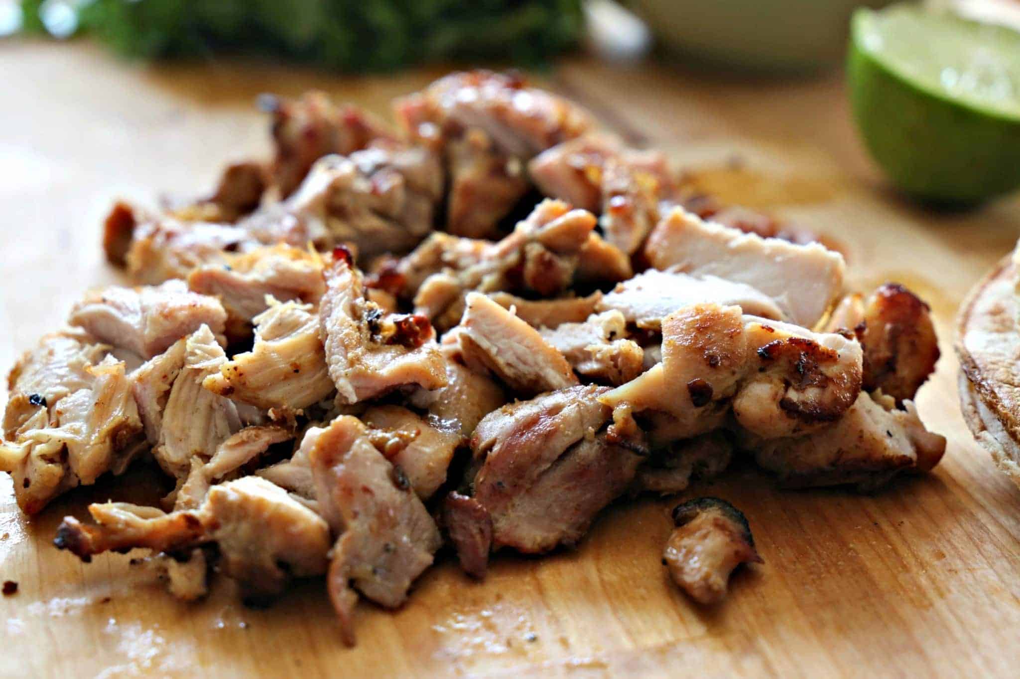 Chopped Chicken on a wooden cutting board.