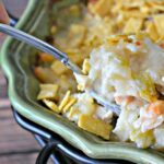 Savory chicken and potatoes casserole topped with crushed tortilla strips.