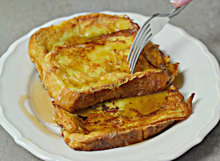 How to Make Brioche French Toast Brioche French Toast slices with maple syrup
