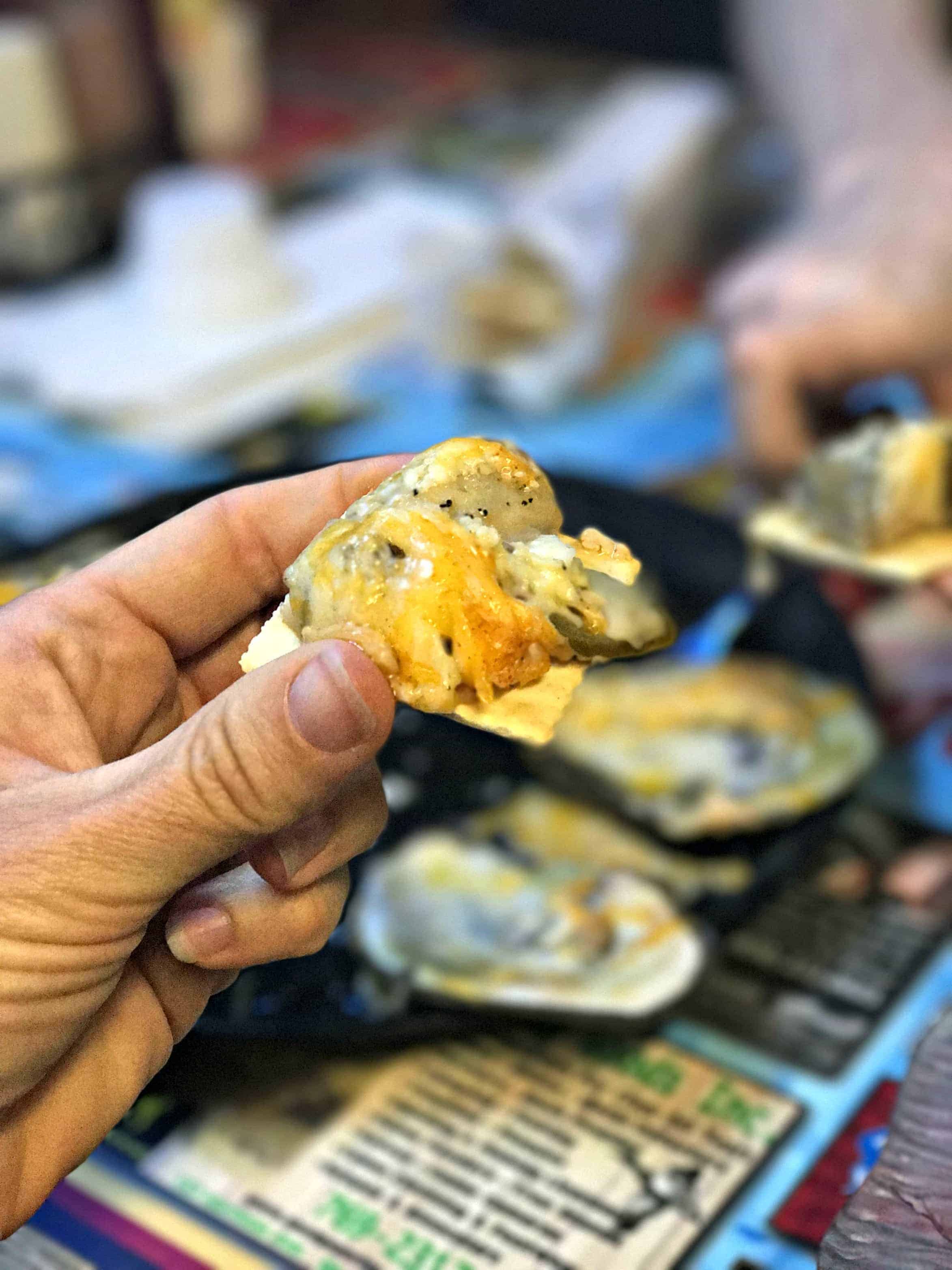 Smoked oyster on a cracker.
