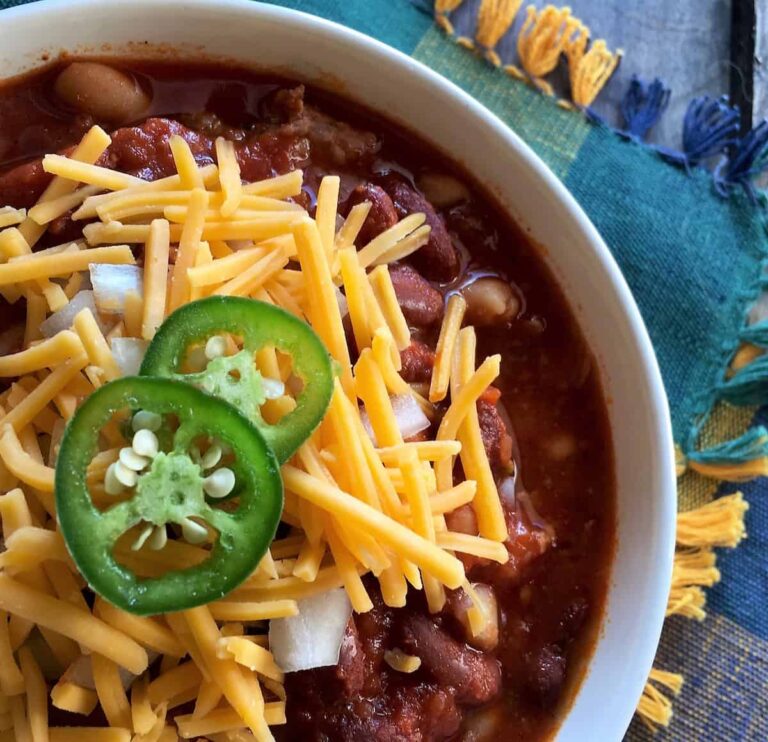 Spicy Slow Cooker Chili bowl of spicy slow cooker chili topped with cheese