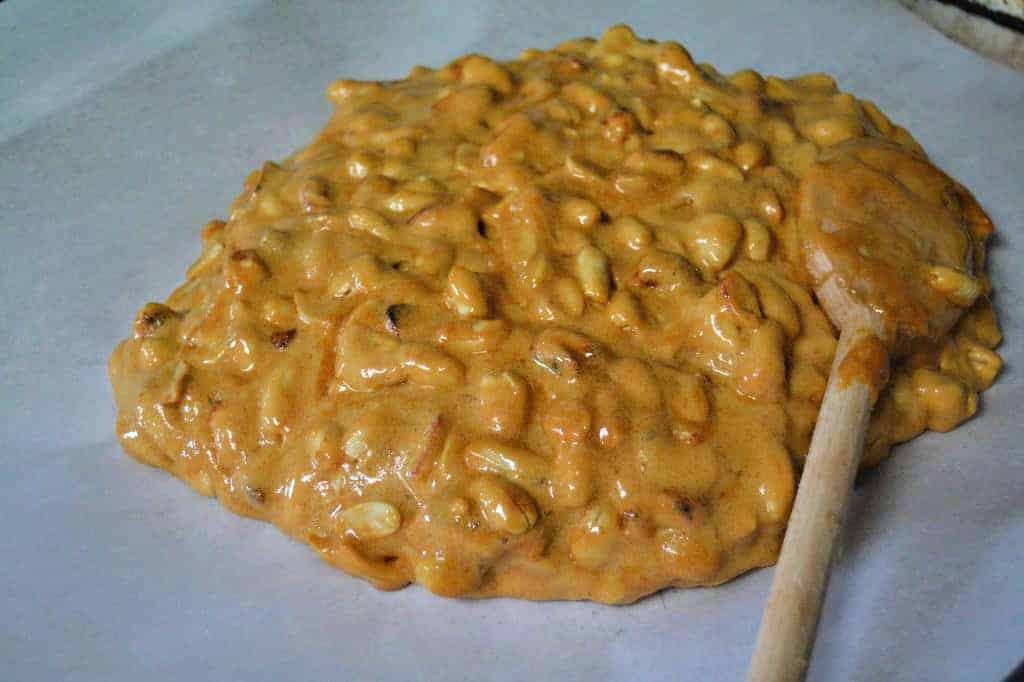 spread peanut brittle on parchment paper