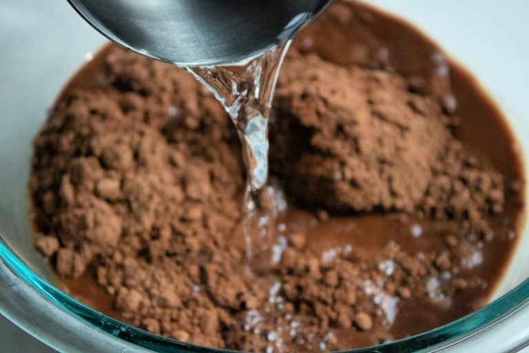 pouring boiling water into cocoa