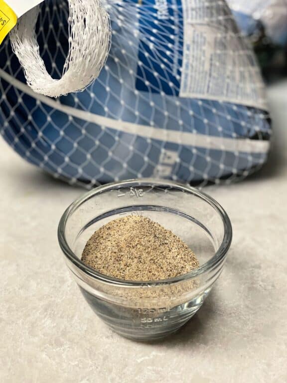 turkey in a bag and seasonings in a glass bowl