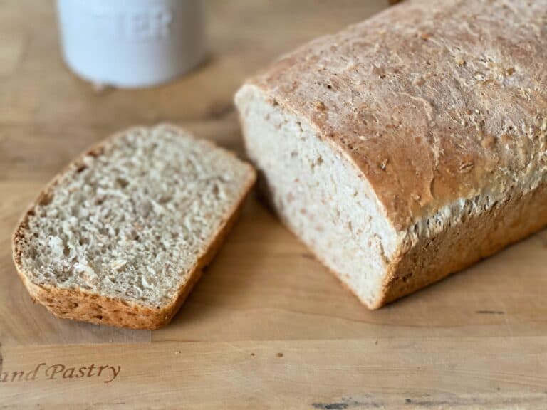 slice of 5 grain bread on cutting board