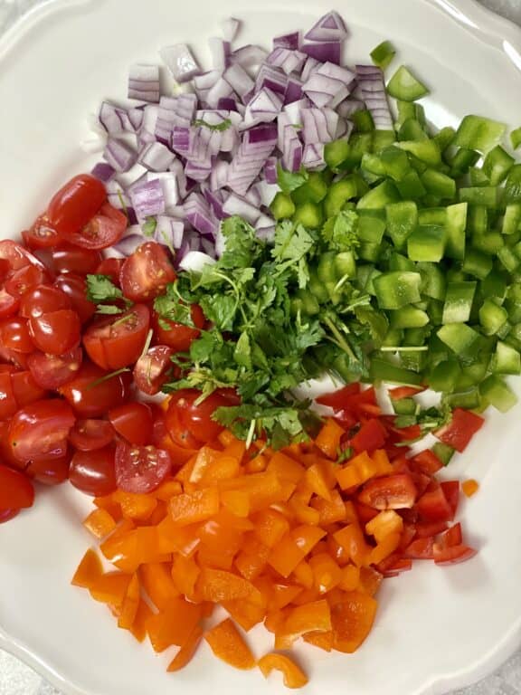 chopped bell peppers, onion, cherry tomatoes, and cilantro
