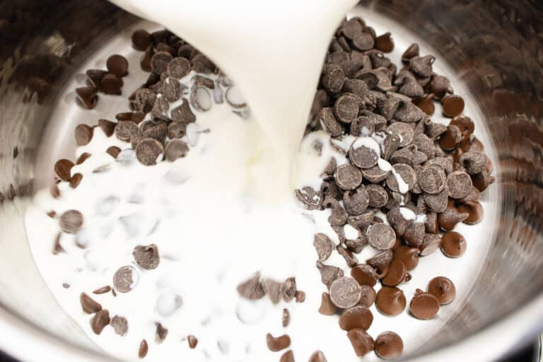 pouring cream over chocolate chips