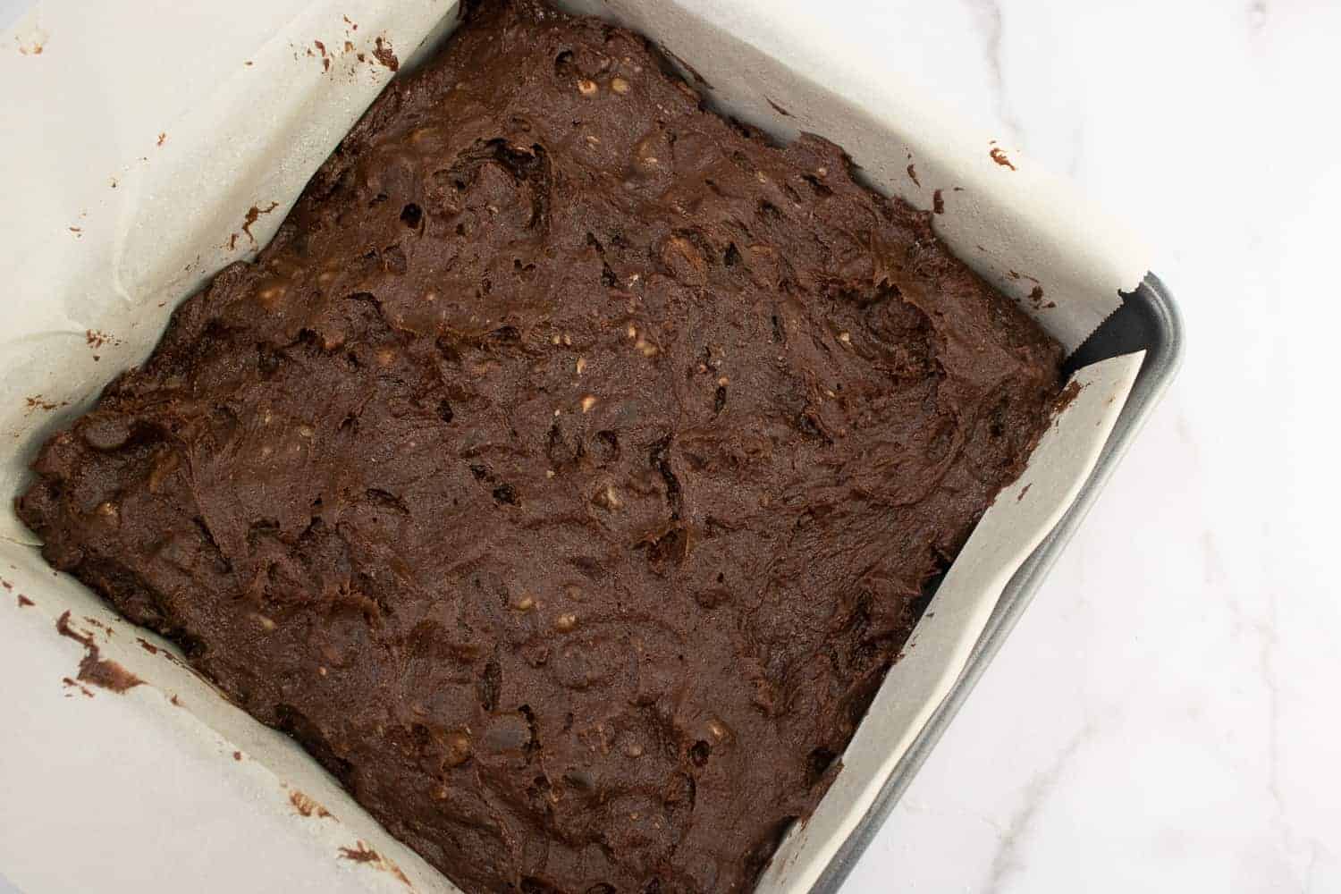 brownie batter in a pan