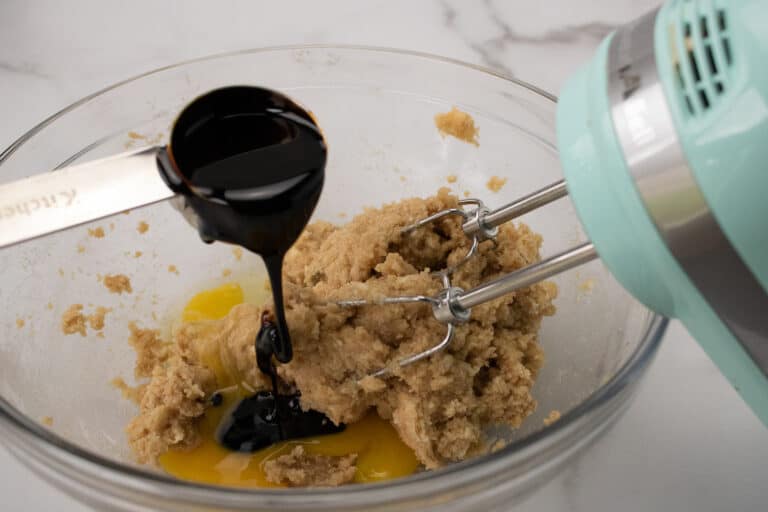 adding molasses to cookie dough