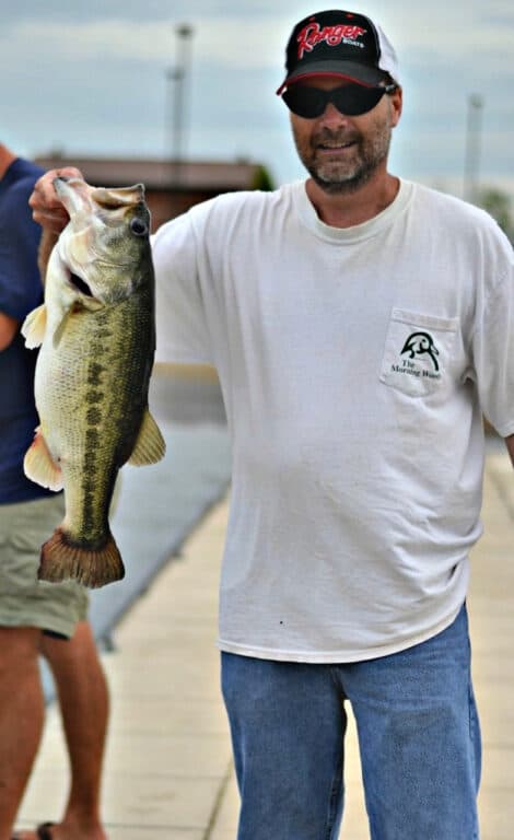 man holding a large mouth bass