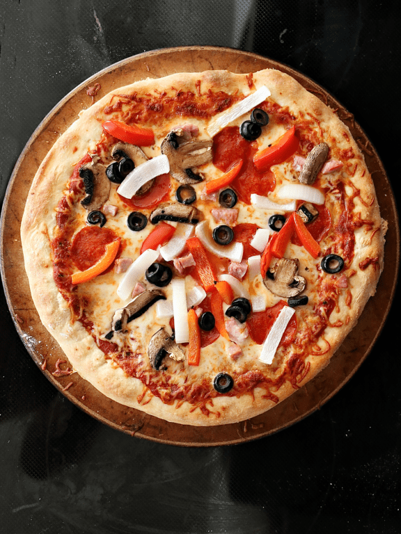 homemade pizza on a baking stone