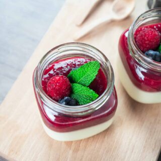 jar of panna cotta with berries on top