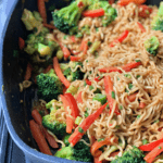 pan of ramen with vegetables and peanut sauce