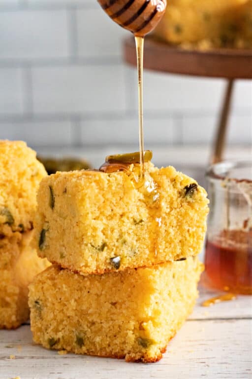 Jalapeño Cornbread with honey being drizzled on top