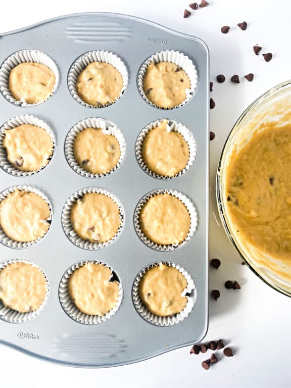 banana muffin batter in muffin tin