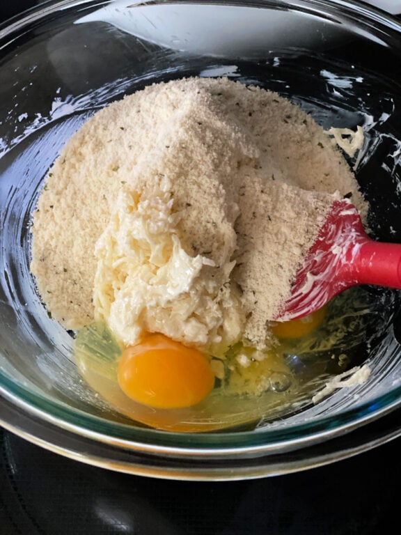 adding ingredients to make keto biscuits