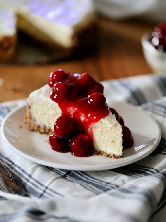 Cheesecake with Oatmeal Cookie Crust Baked Cheesecake topped with cherries