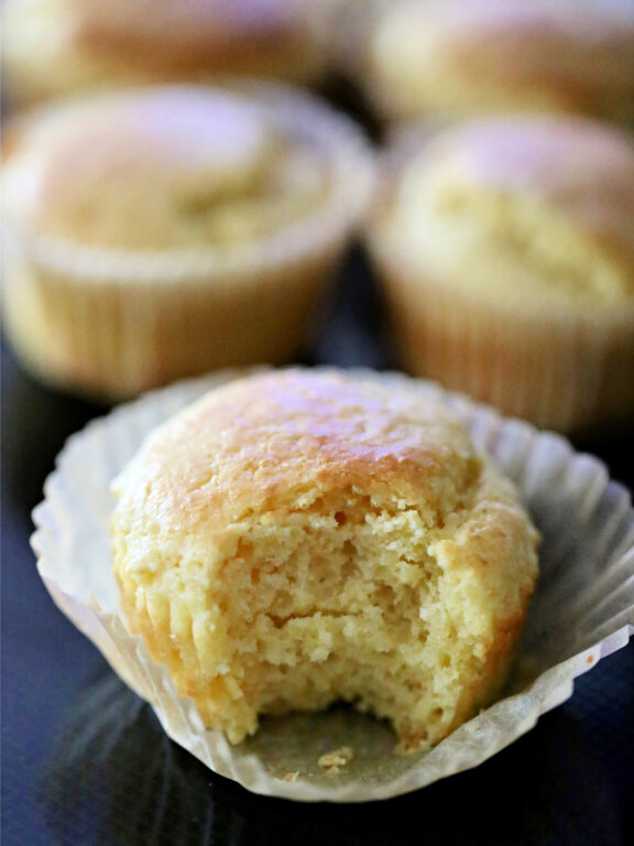 a sweet cornbread muffin with a bite taken out of it