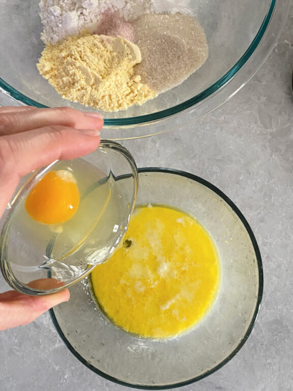 mixing an egg and melted butter together