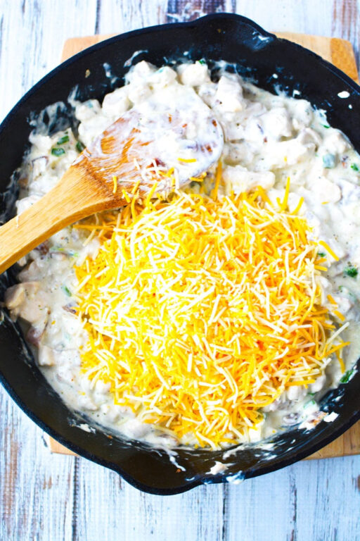 Oven Baked Chicken Taquitos with creamy chicken and cheese filling for a Mexican Appetizer everyone will love #Mexican #appetizer #sidedish #recipe adding cheese