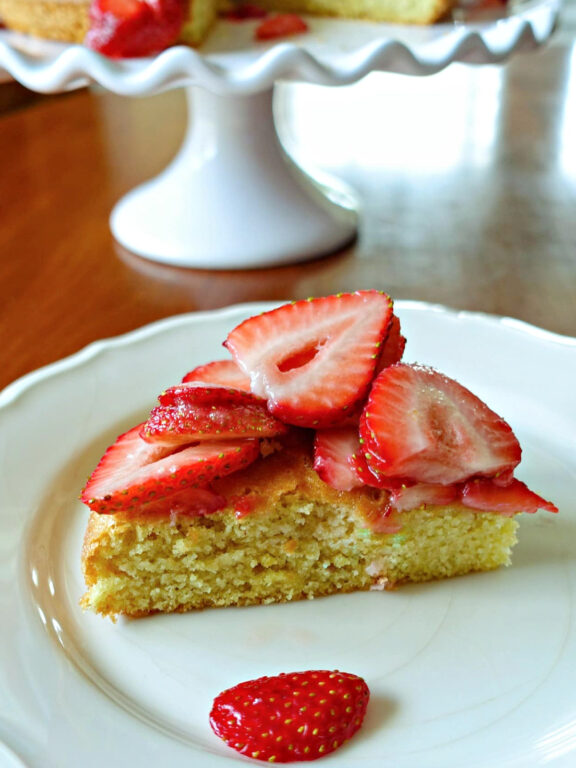 Strawberry Almond Flour Cake slice of almond cake topped with strawberries