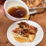 Syrup being poured on top of French toast casserole
