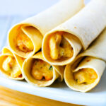 stack of taquitos on a plate