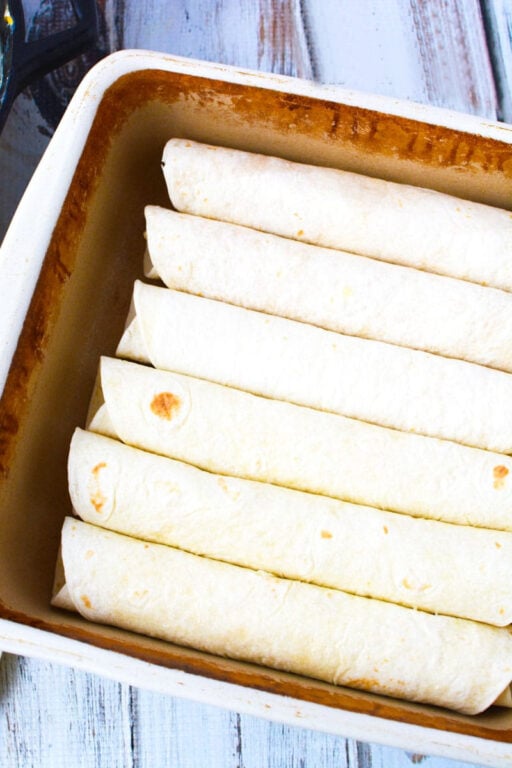 Oven Baked Chicken Taquitos with creamy chicken and cheese filling for a Mexican Appetizer everyone will love #Mexican #appetizer #sidedish #recipe taquitos in baking dish