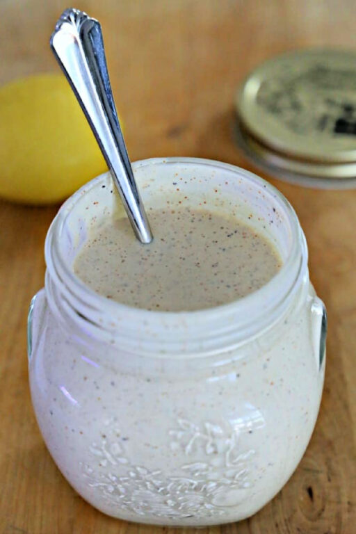 jar of Alabama White Sauce with spoon in it