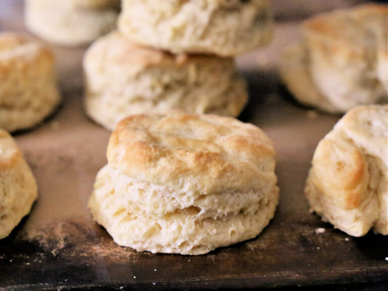 Southern style homemade biscuits. Learn how to make homemade buttermilk biscuits with only three ingredients. These classic Southern biscuits are so easy! biscuits on baking stone
