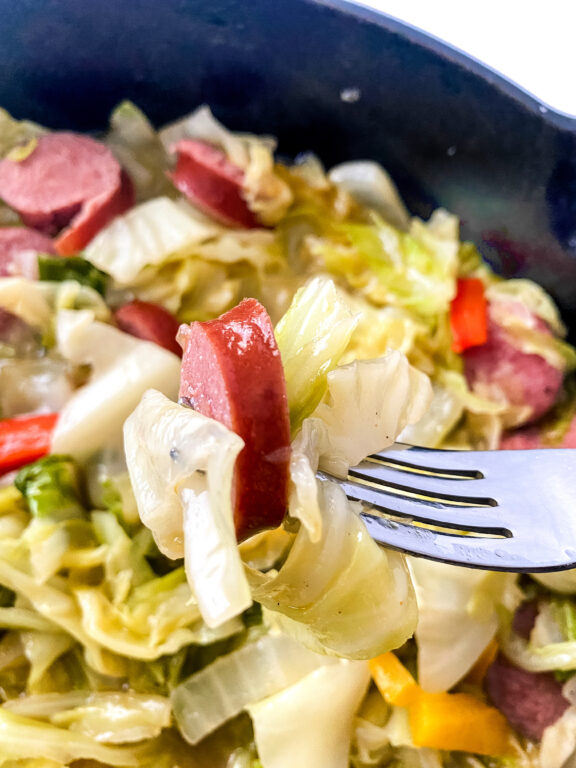 bite of sausage and cabbage