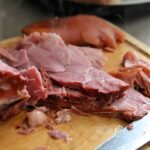hot ham on a cutting board