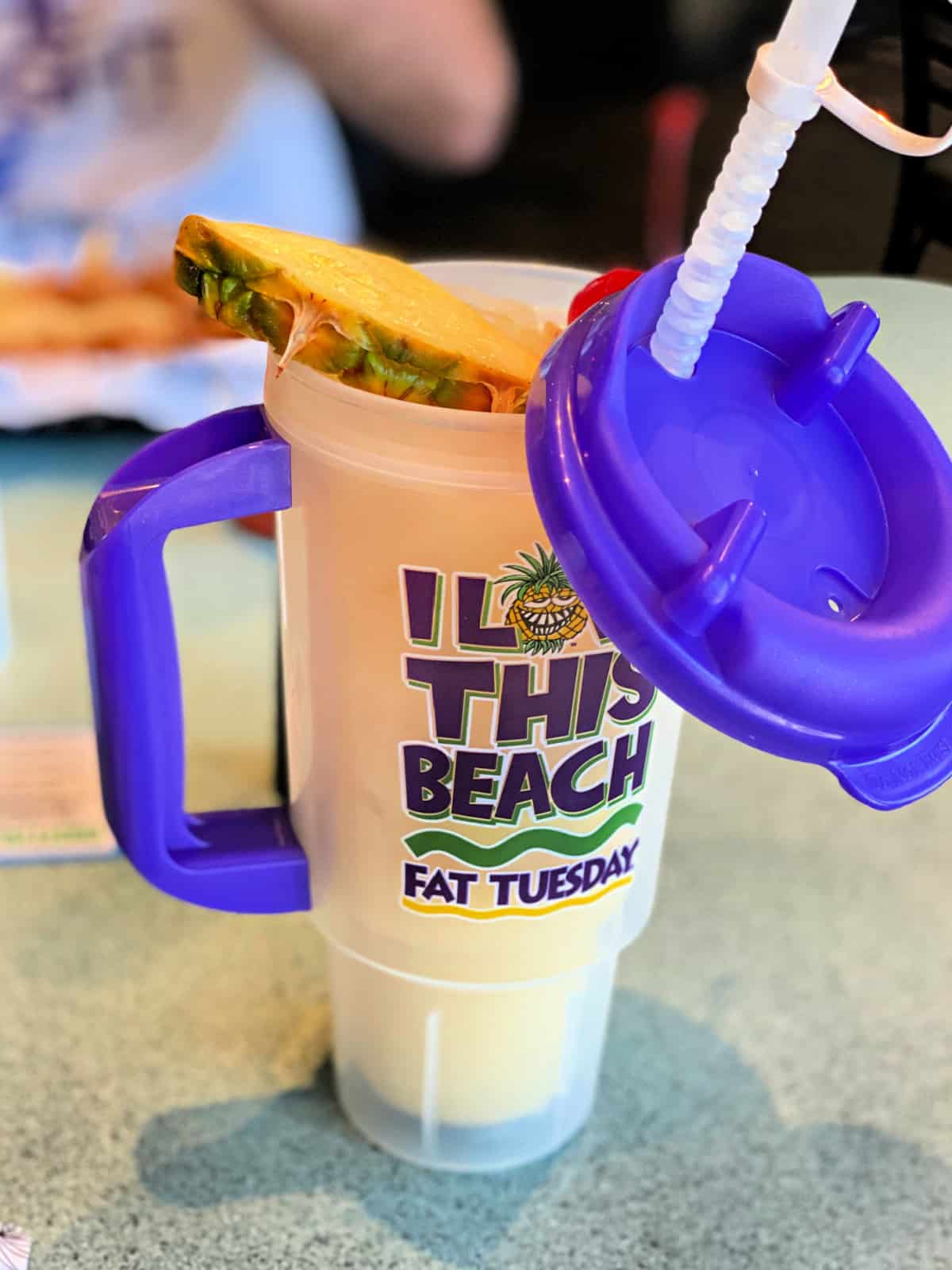 Pineapple Willy adult beverage in a souvenir cup.