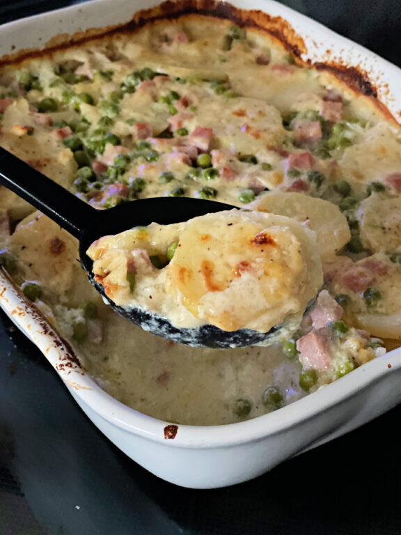 scoop of scalloped potatoes and ham