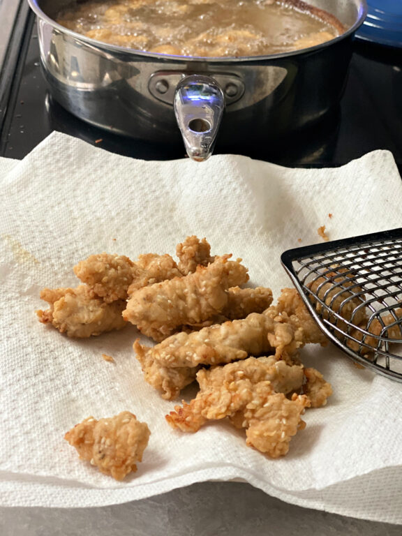 small batch of fried sesame chicken nuggets