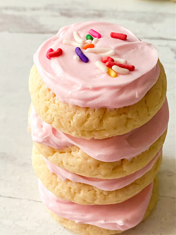 stack of Lofthouse sugar cookies with pink icing