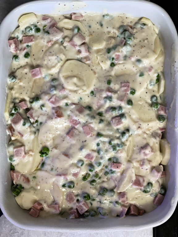 top layer of scalloped potatoes and ham