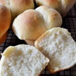 dinner rolls on a wire rack