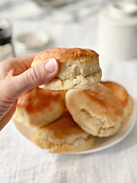woman holding a Southern biscuit